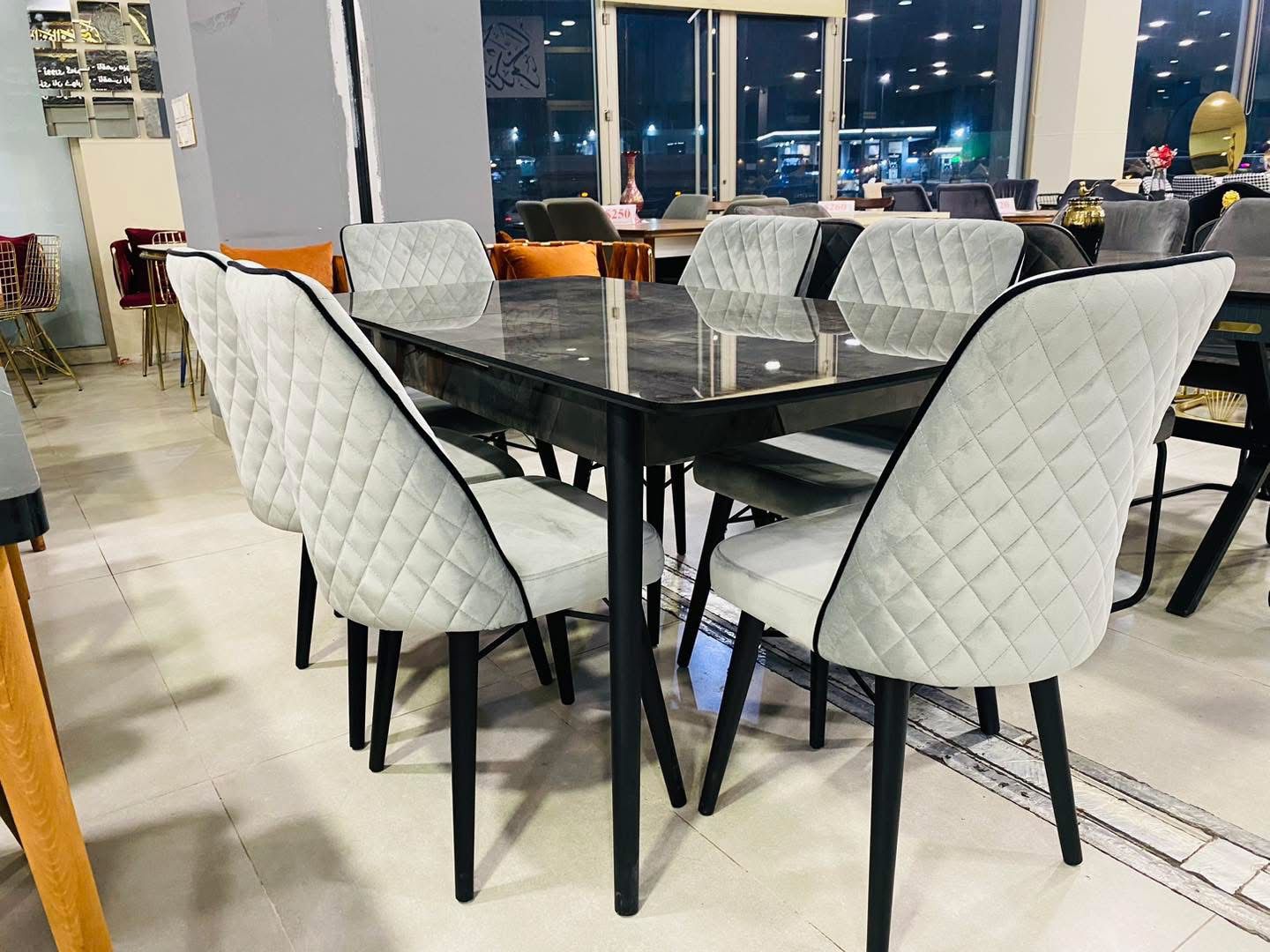 Black Glass Dining Table with Light Grey Chairs